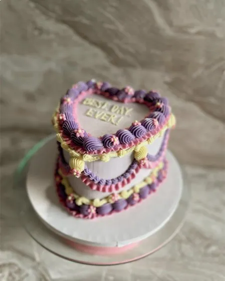 Lavender and butter yellow heart cake reading best day ever